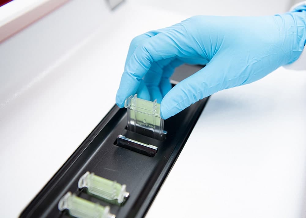 Slide cassette being loaded into the Cryostainer instrument